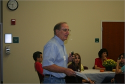 Paul Hornberger, volunteer tutor, welcomes everyone to the celebration.